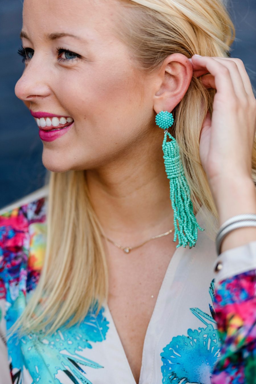 Amy Believes in Pink wearing Coquina tassel earrings and Goodnight Macaroon romper