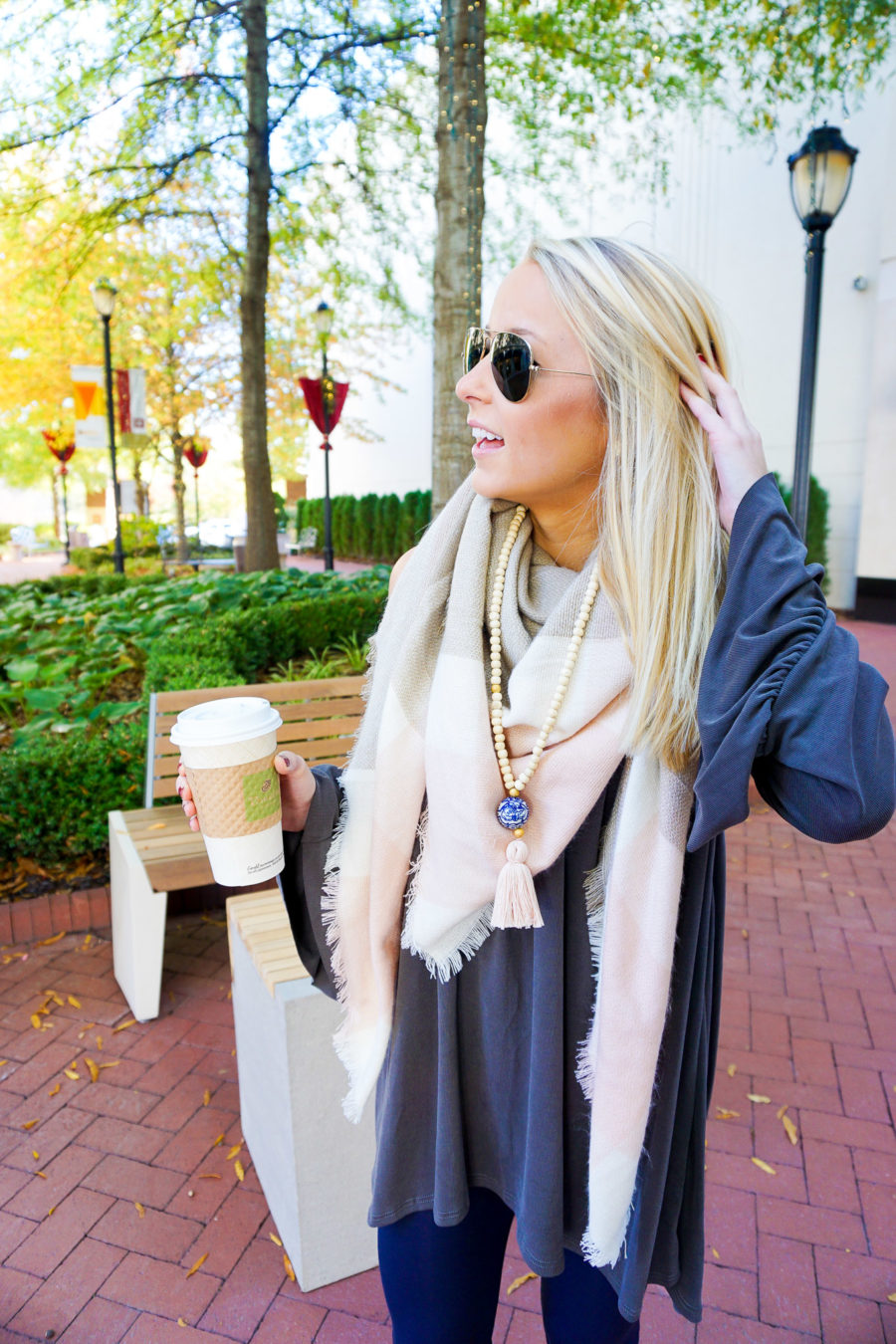 amy-from-i-believe-in-pink-wearing-swirling-honey-boutique-cold-shoulder-top-and-tiny-tassel-jewelry-and-uniqlo-leggings-9