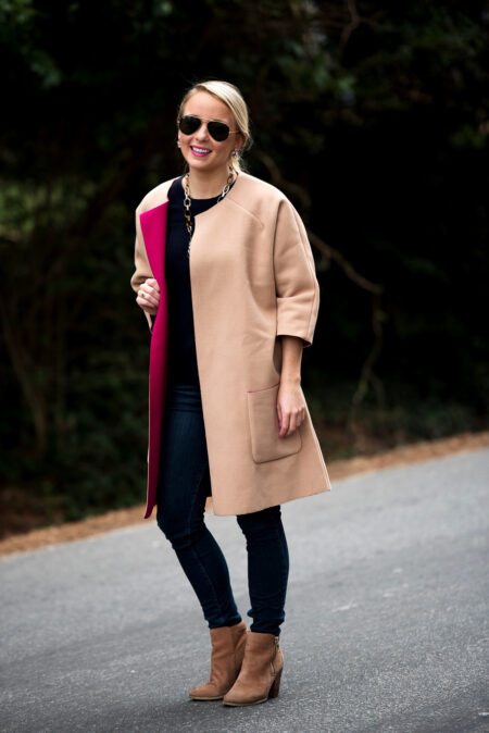 Amy Littleson from I Believe in Pink in navy cashmere crewneck sweater, and a camal and hot pink coat-2
