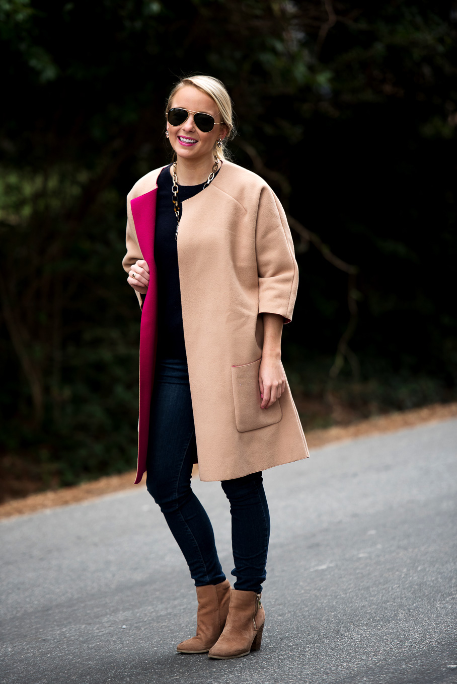Amy Littleson from I Believe in Pink in navy cashmere crewneck sweater, and a camal and hot pink coat-2