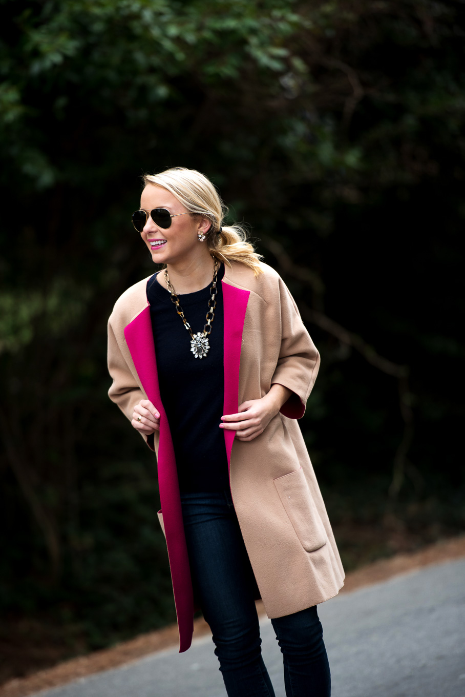 Amy Littleson from I Believe in Pink in navy cashmere crewneck sweater, and a camel and hot pink coat-2