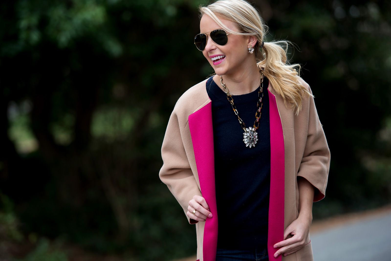 Amy Littleson from I Believe in Pink in navy cashmere crewneck sweater, and a camel and hot pink coat-2