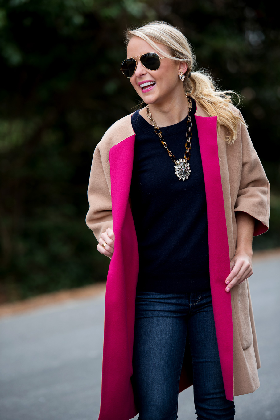 Amy Littleson from I Believe in Pink in navy cashmere crewneck sweater, and a camel and hot pink coat-2