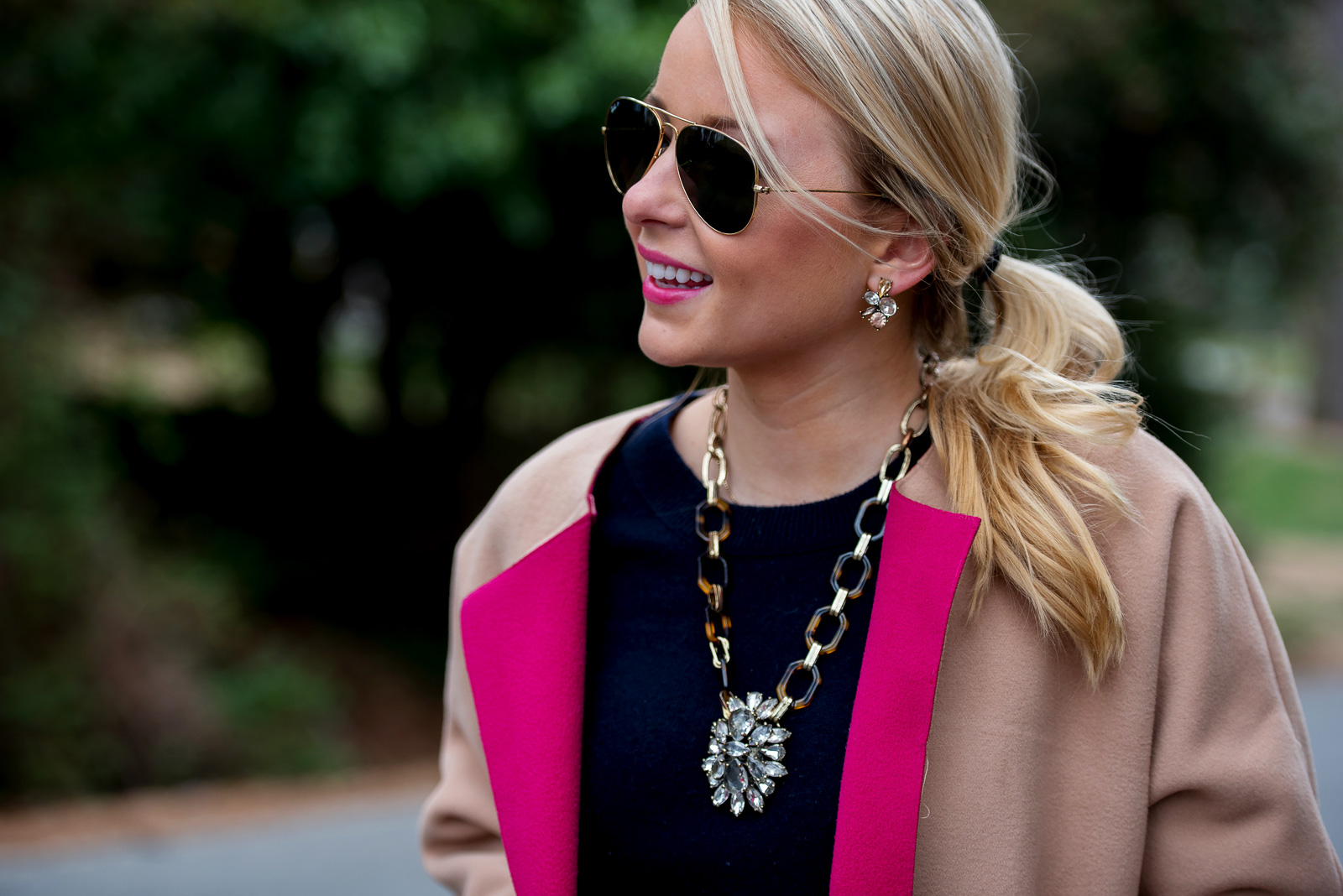 Amy Littleson from I Believe in Pink in navy cashmere crewneck sweater, and a camel and hot pink coat-2