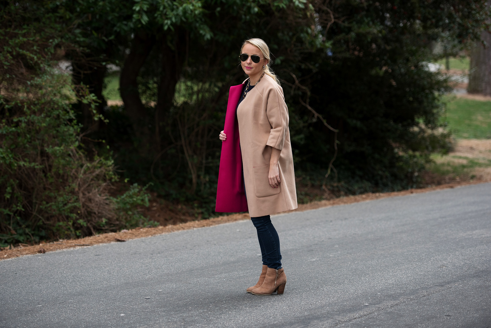Amy Littleson from I Believe in Pink in navy cashmere crewneck sweater, and a camal and hot pink coat-2