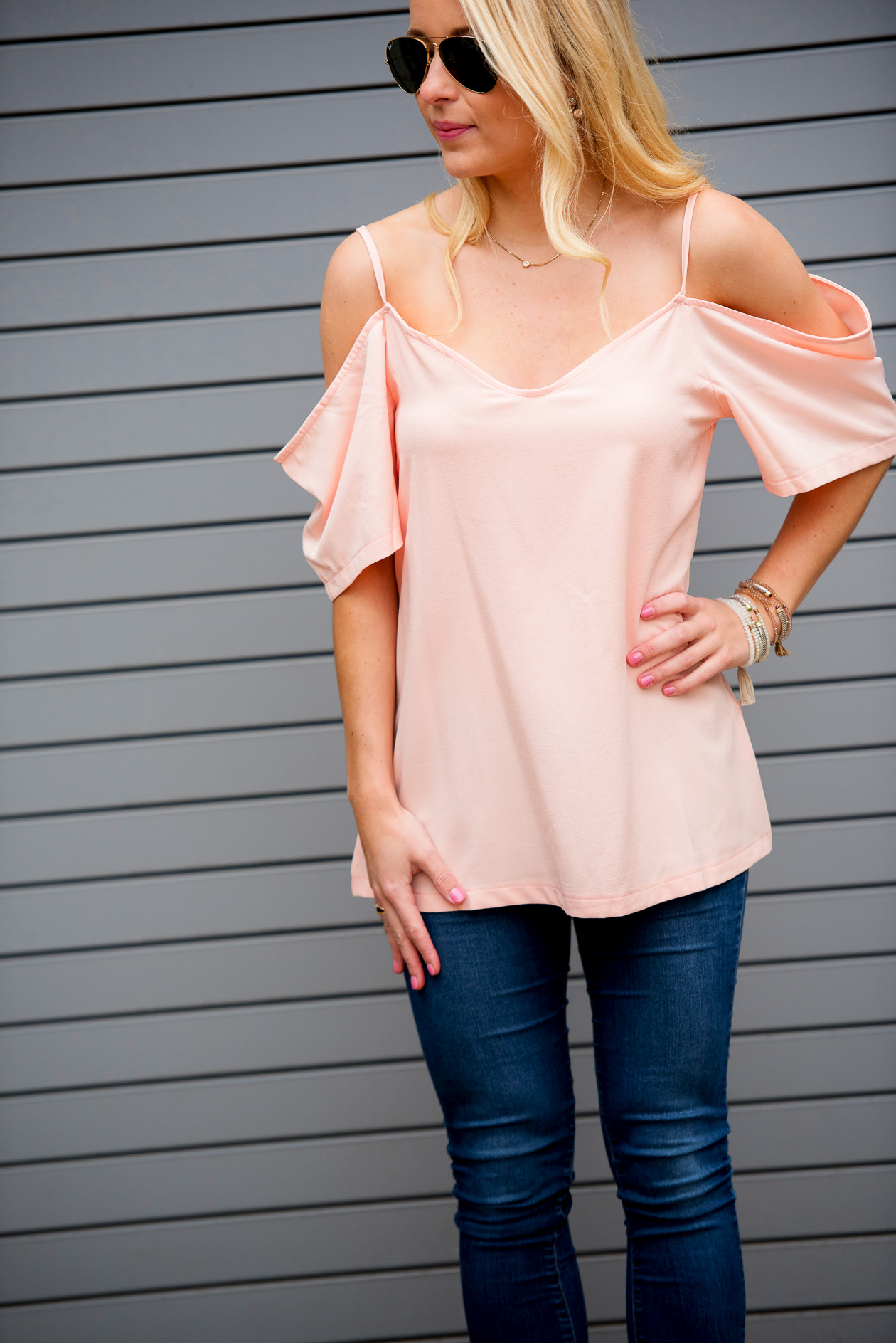 Amy from I Believe in Pink in Boohoo cold shoulders top, Minnie and Emma x Jack Rogers iPhone case and SUGARFIX earrings_
