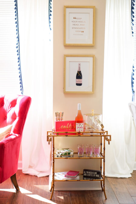 Gold bamboo bar card with pink and green banana leaf decorations in Philadelphia apartment