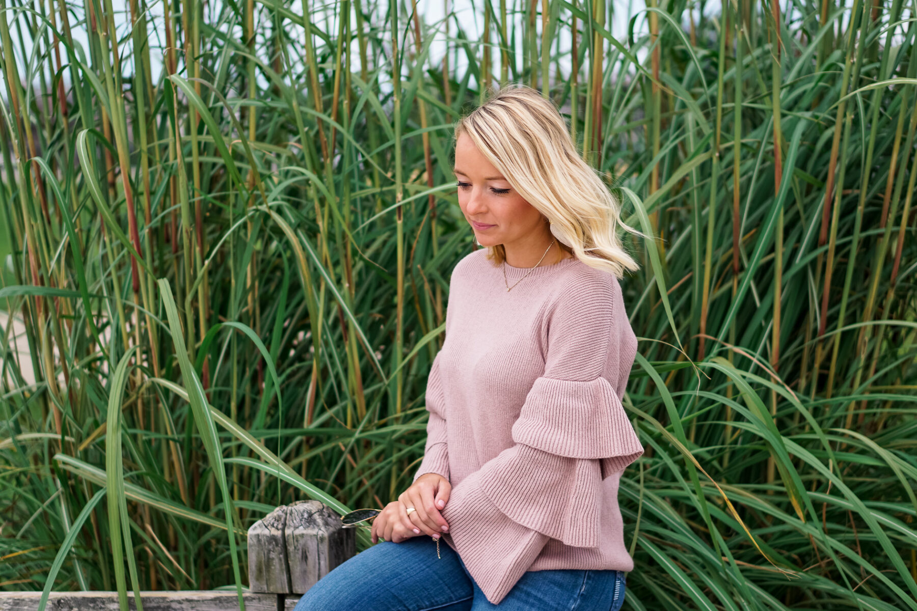 Blush ruffle Nordstrom sweater and bow booties with Lisi Lerch tassel earrings