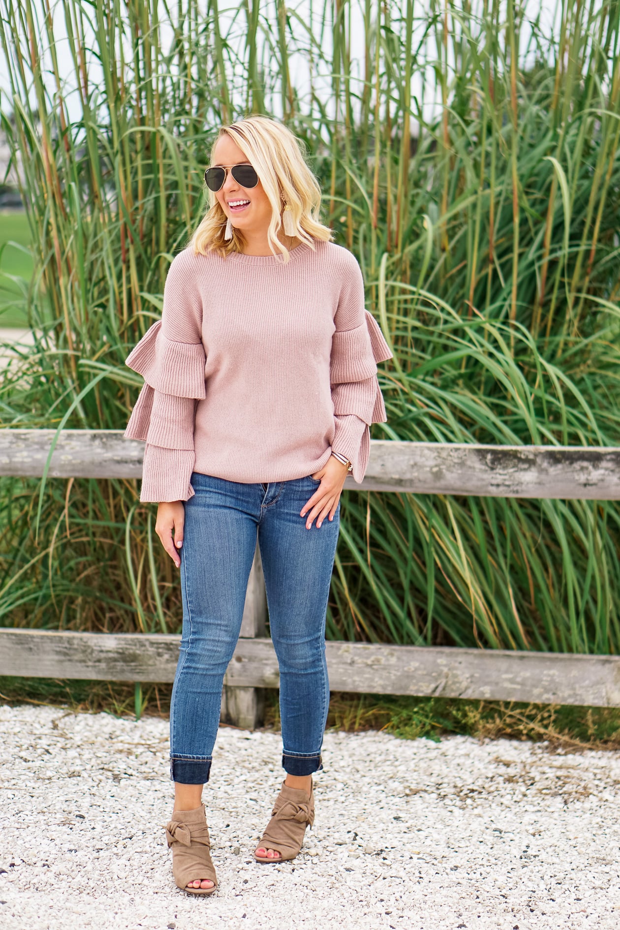 Blush ruffle Nordstrom sweater and bow booties with Lisi Lerch tassel earrings