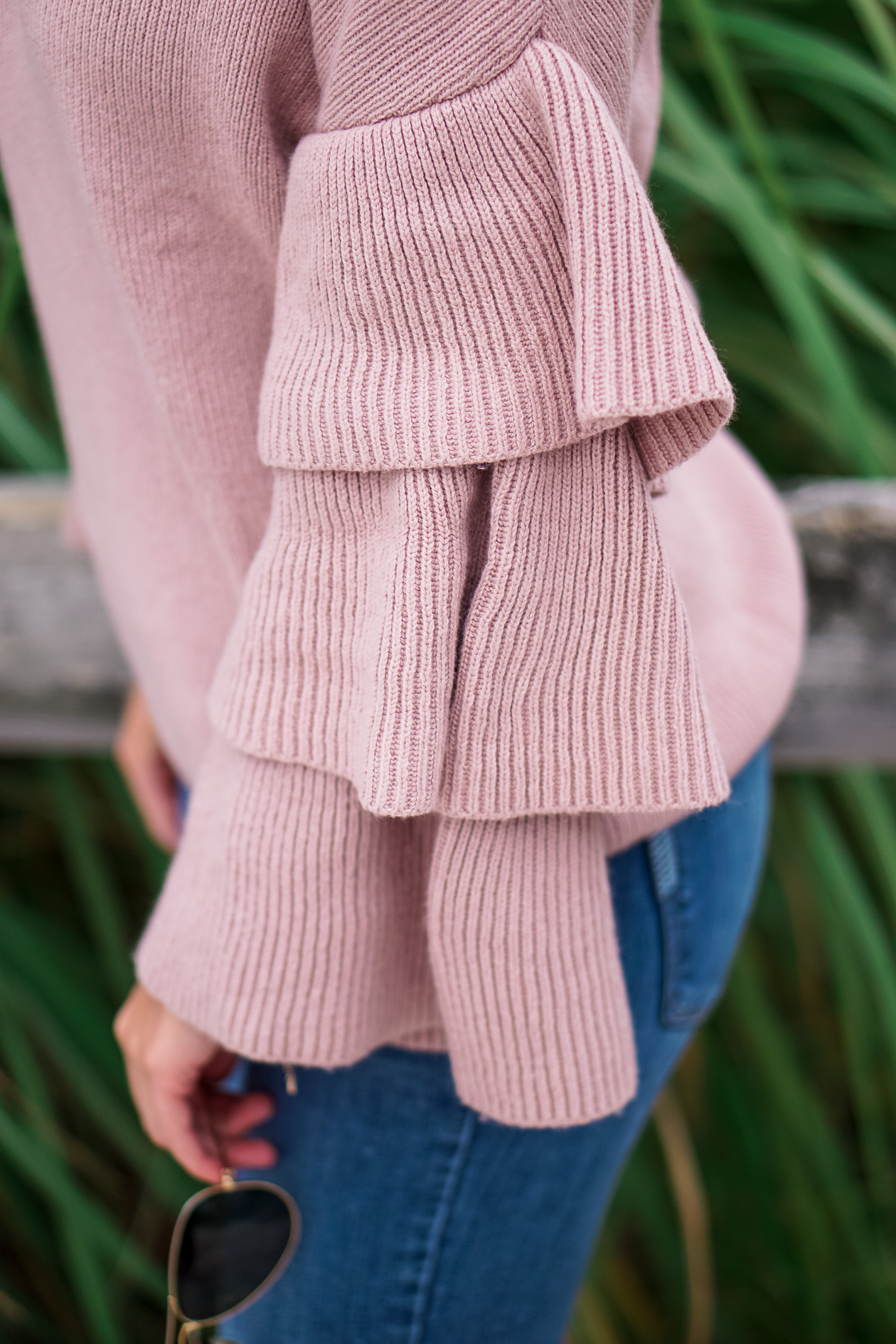 Blush ruffle Nordstrom sweater and bow booties with Lisi Lerch tassel earrings