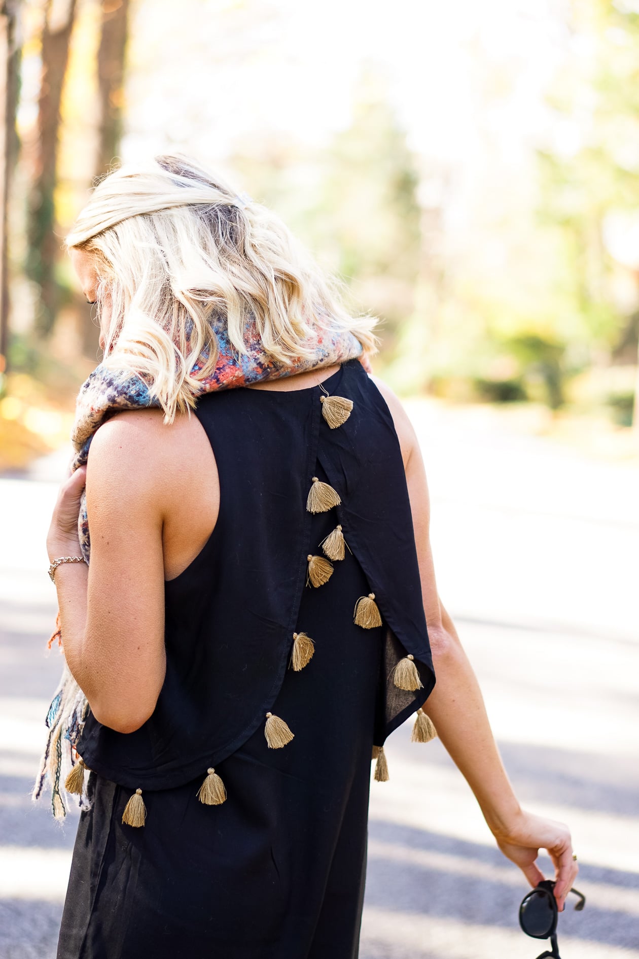 Black dress with gold tassels and blanket scar