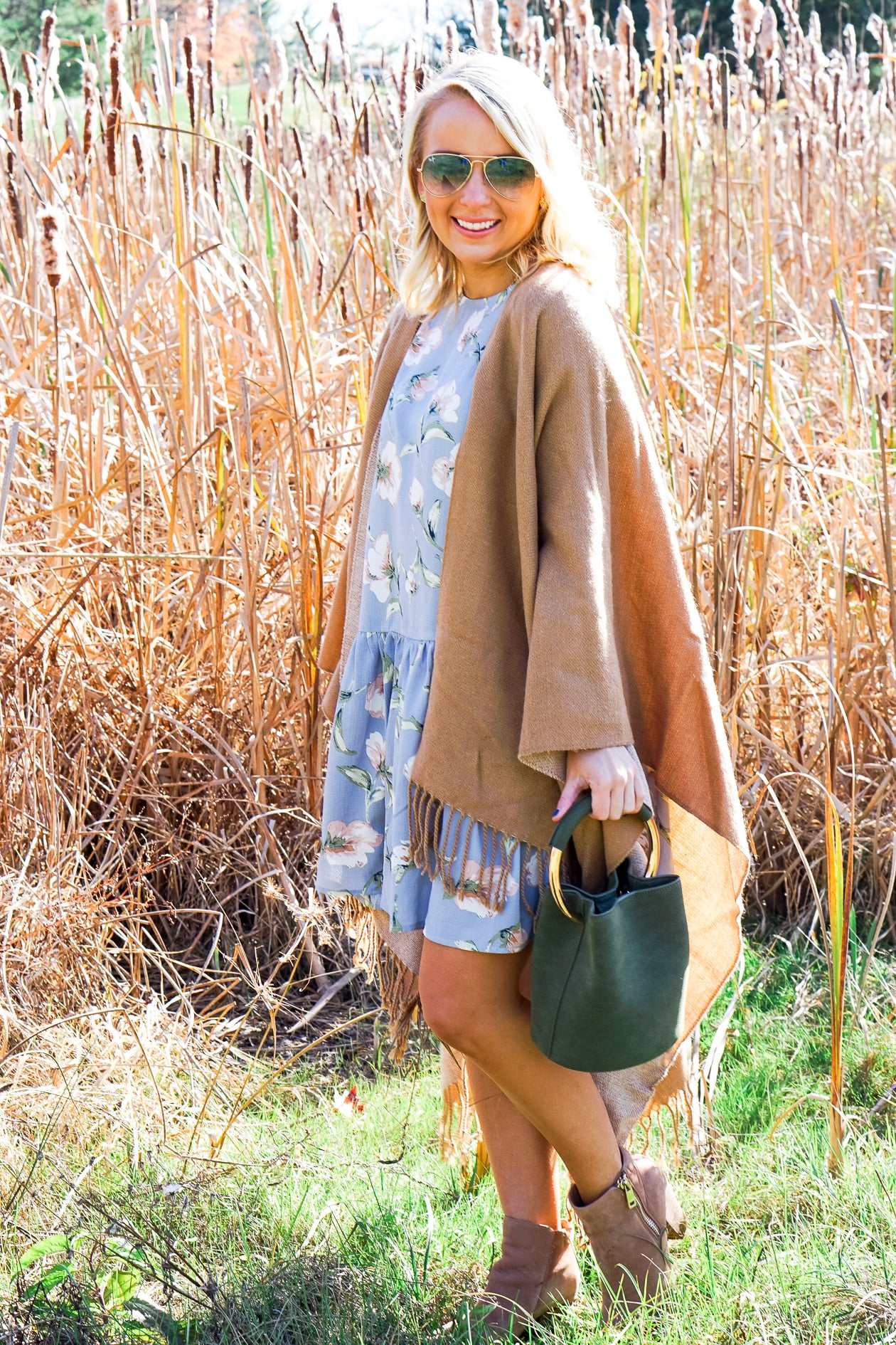 Camel tassel poncho and blue floral dress for Thanksgiving outfit