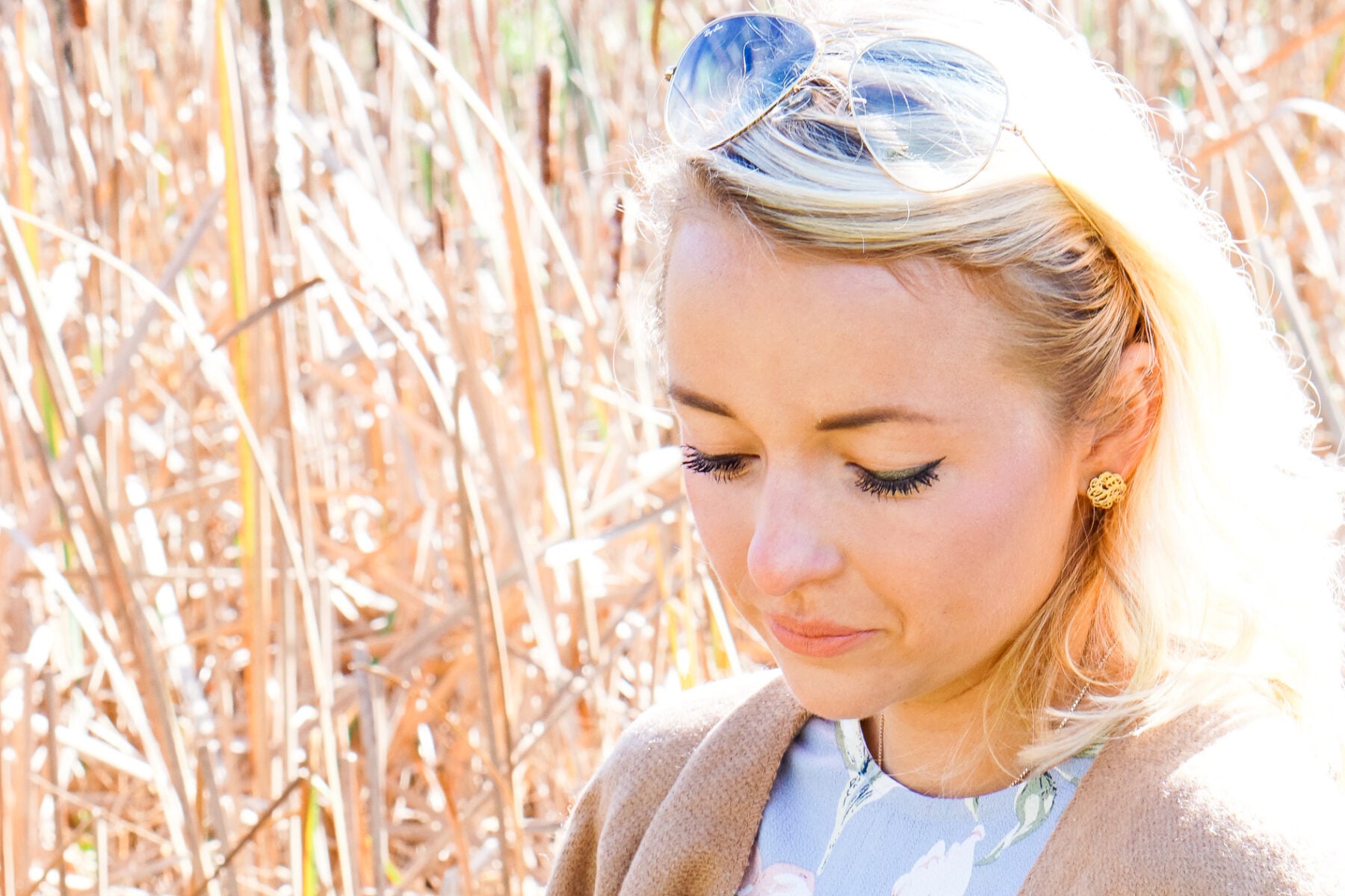 Camel tassel poncho and blue floral dress for Thanksgiving outfit