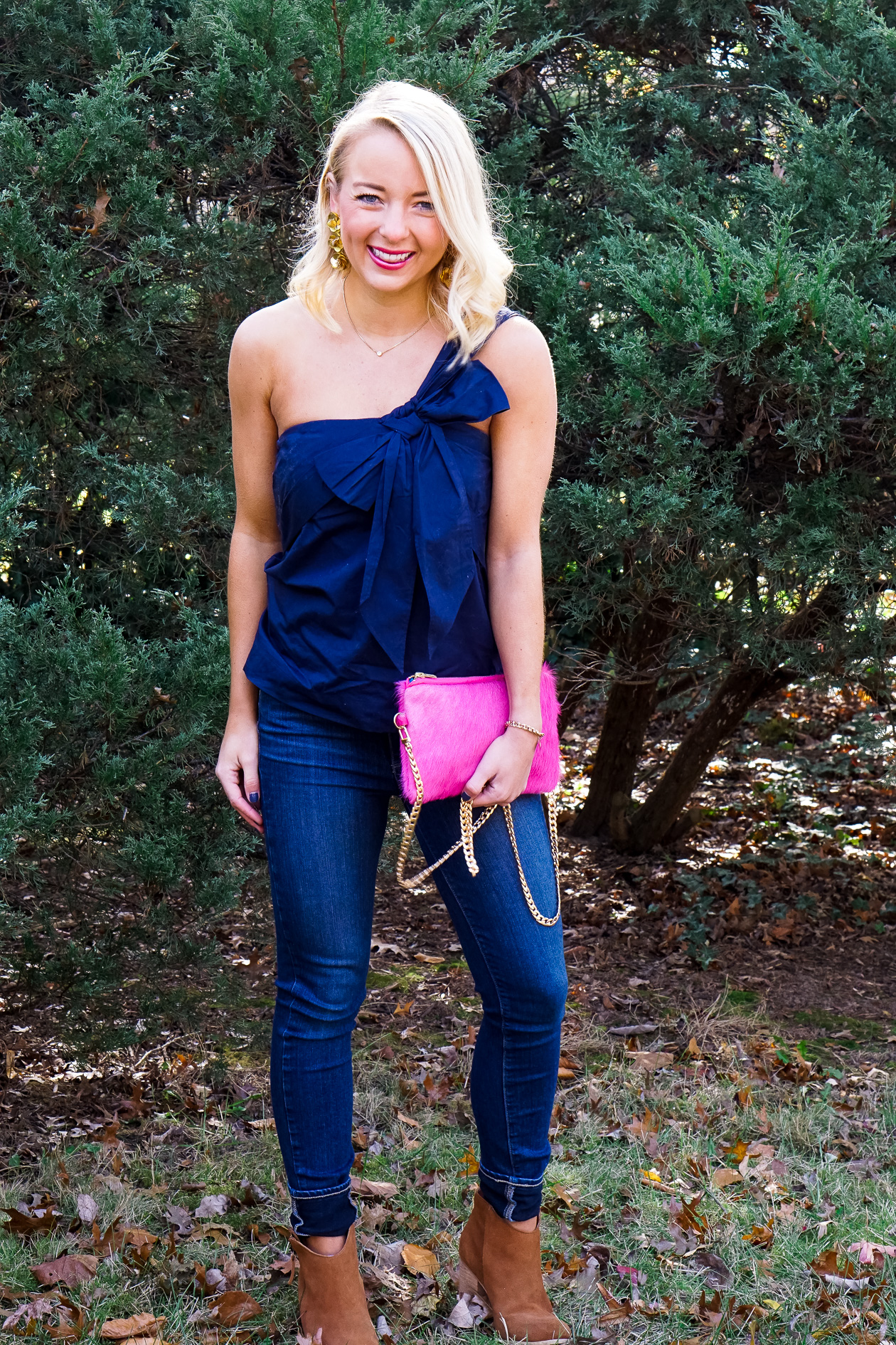 Navy J Crew bow top and pink cow hide clutch