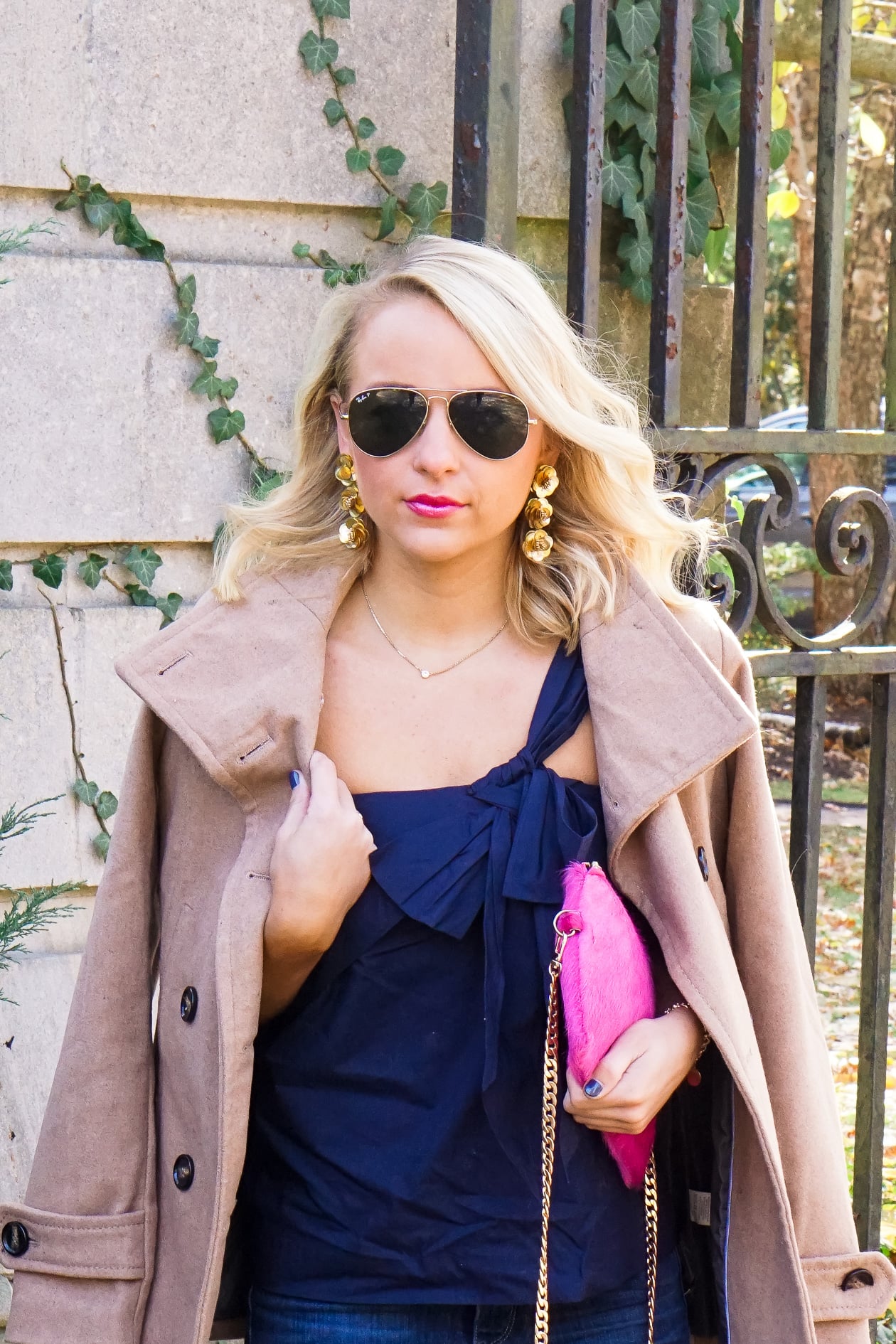 Navy J Crew bow top and pink cow hide clutch