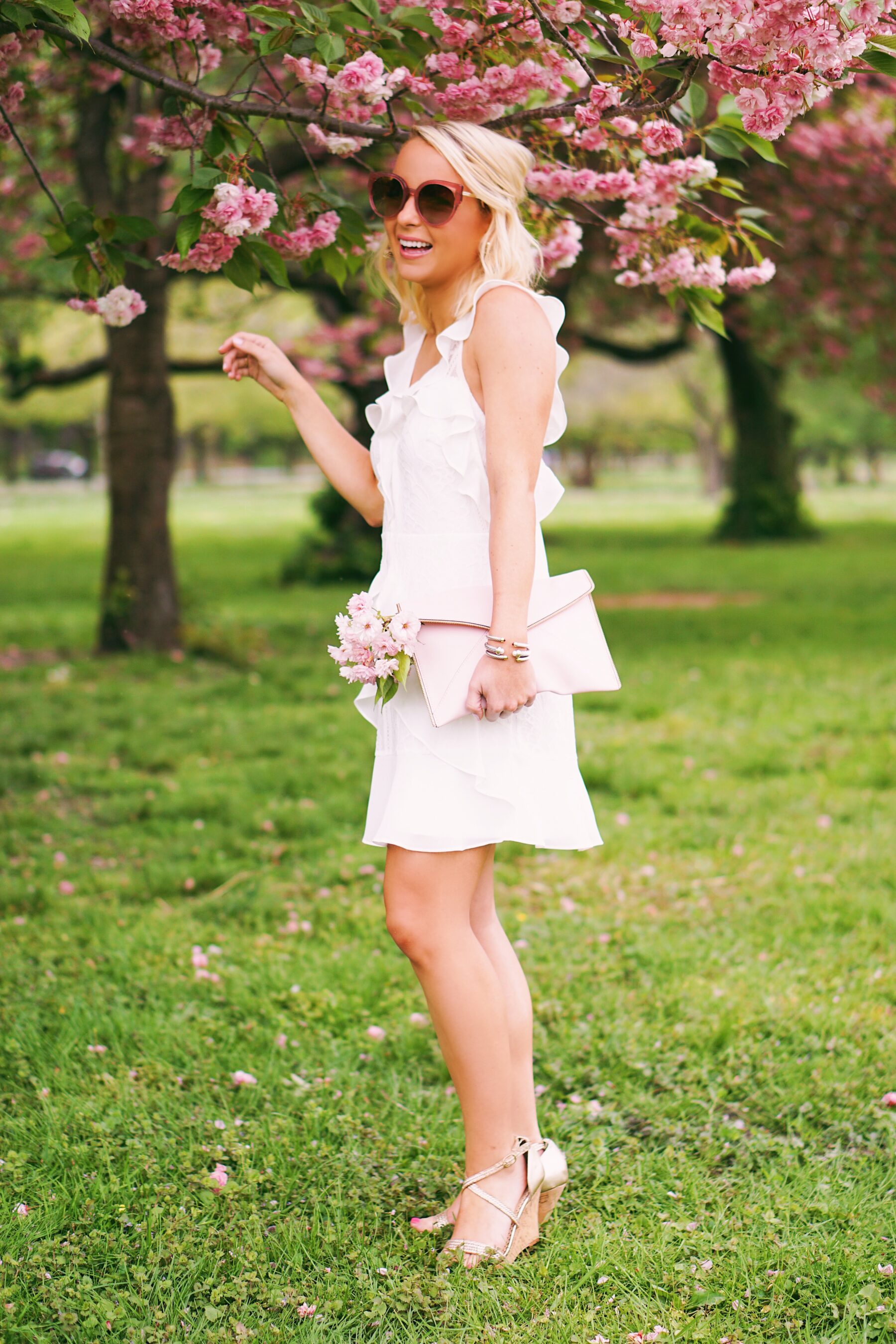 Red Dress Boutique white lace dress in cherry blossoms in Philadelphia