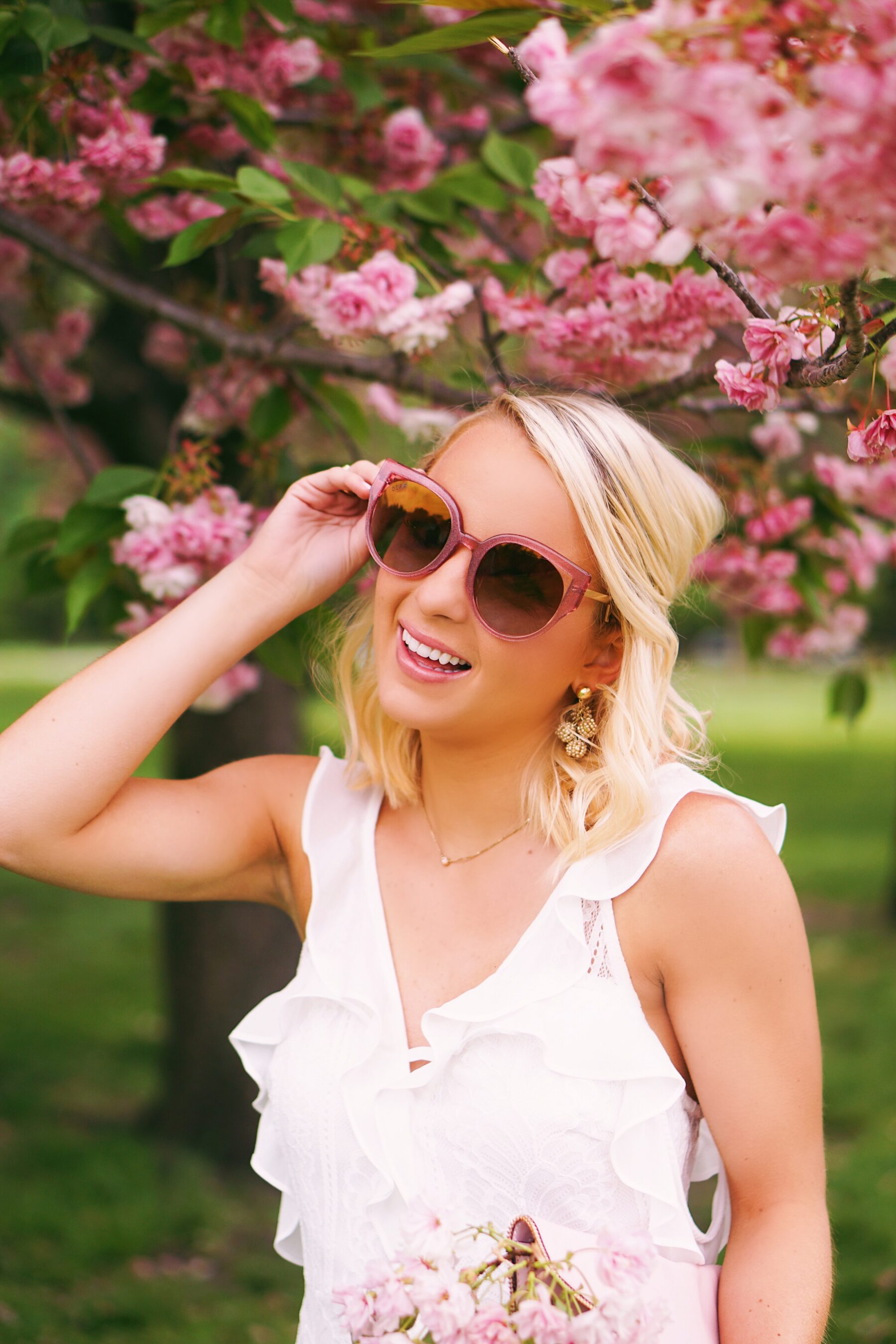 Red Dress Boutique white lace dress in cherry blossoms in Philadelphia