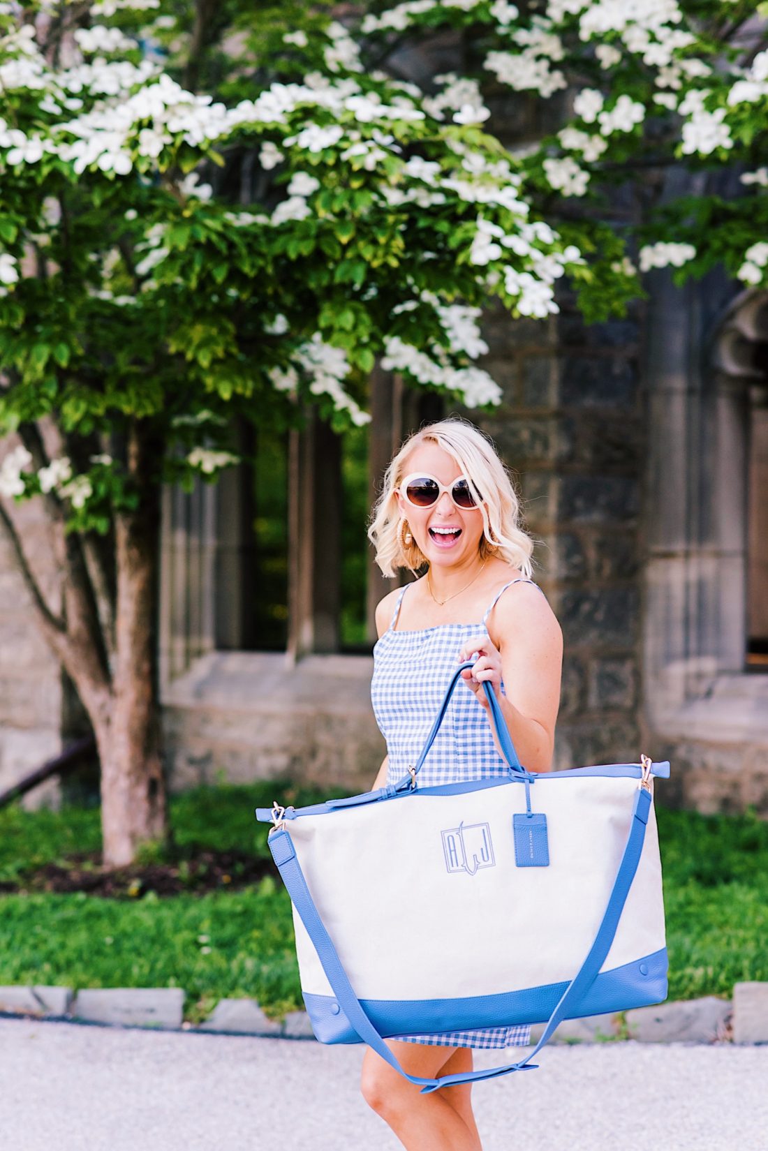 Memorial Day Weekend sales in a gingham dress and monogrammed weekender bag